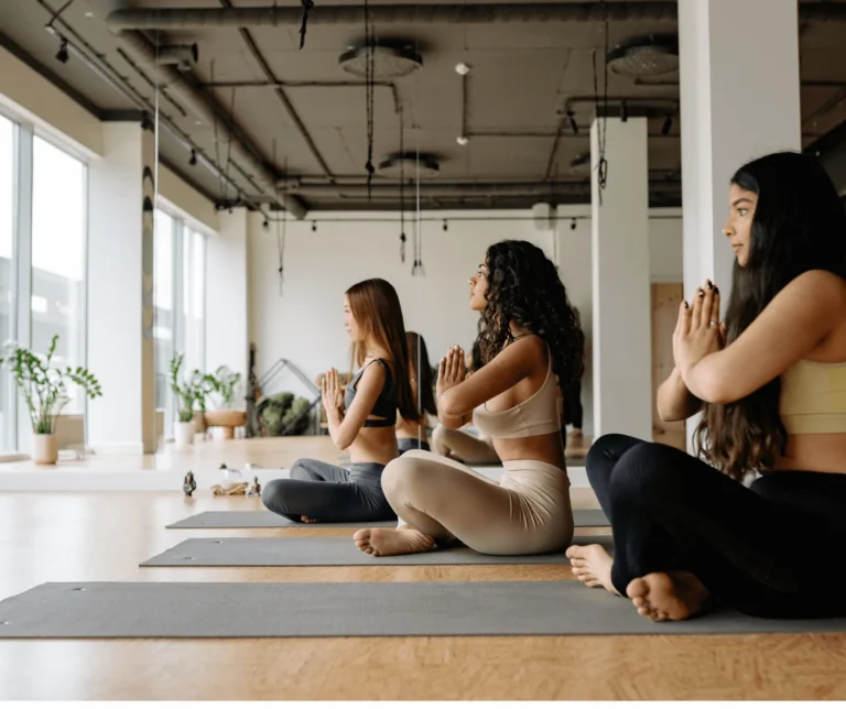 Women meditating together in a yoga studio
